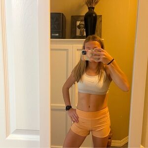 kids athleta light orange shorts!